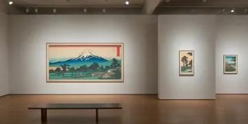 Vibrant ukiyo-e print in modern US gallery setting