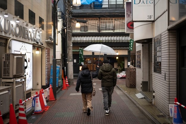 A bustling street scene in Tokyo, showcasing the modern architecture and vibrant atmosphere of a Japanese urban center.