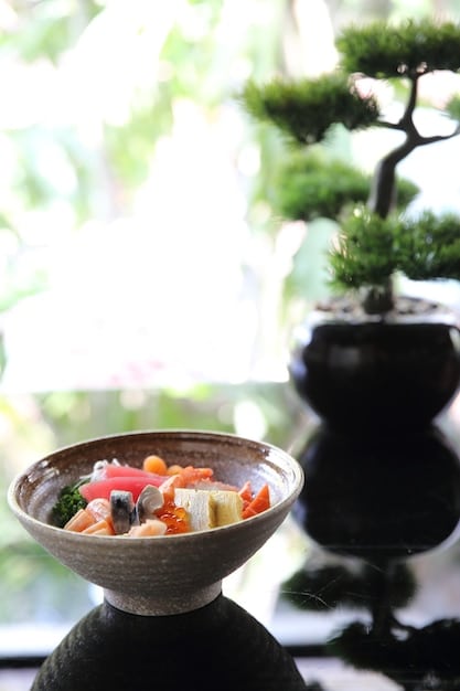 A visually appealing scene of a traditional Japanese meal setting, showcasing various dishes served in small bowls, emphasizing the aesthetic presentation and variety of Japanese cuisine.