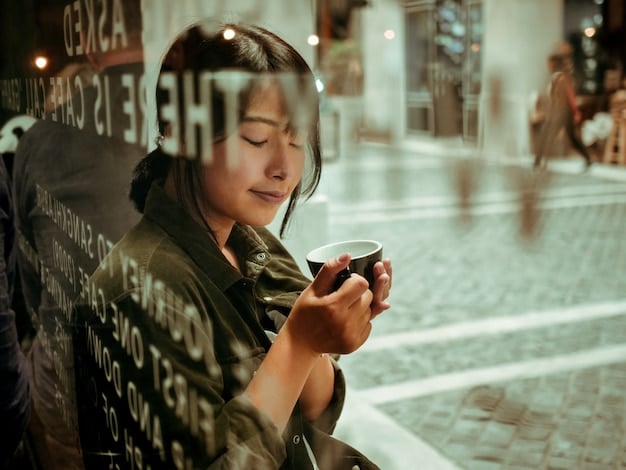 A person using their smartphone to make a transaction via a mobile payment app in a modern cafe in Tokyo, Japan. The screen shows the app interface with currency options and transaction details.