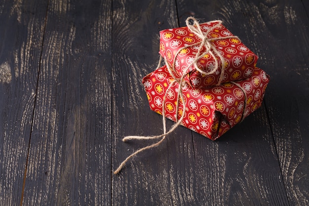 A close-up shot of a beautifully wrapped gift in a Japanese department store. The wrapping paper is ornate, and the ribbon is tied in an elaborate bow.