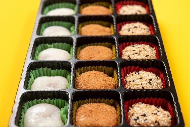 Close-up shot of a shelf stocked with various onigiri (rice balls) in a Japanese convenience store, showcasing the different flavors and colorful packaging.