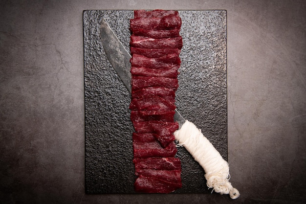 A split image showing the difference between authentic A5 Wagyu beef with intense marbling on one side, and a regular steak with minimal marbling on the other. The contrast should highlight the visual distinction in fat distribution.