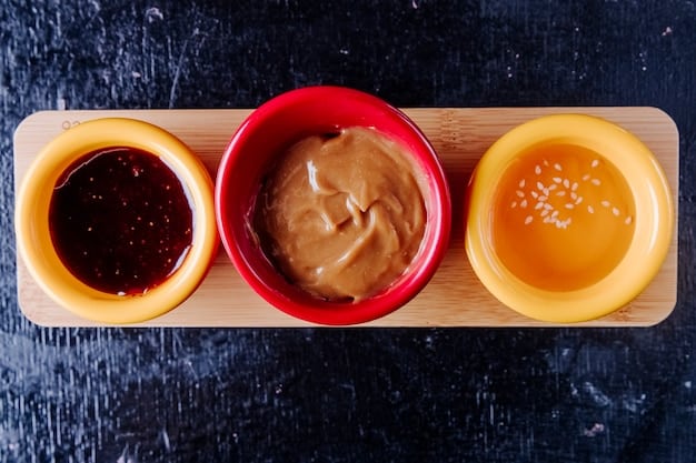 A close-up shot of various types of miso paste in ceramic bowls, showcasing the different colors and textures: light beige for shiro miso, deep red for aka miso, and a darker brown for hatcho miso. Small wooden spoons are placed in each bowl, ready for tasting.