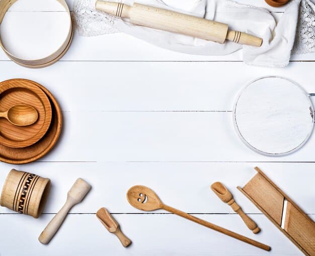 Overhead shot of a kitchen counter with various mochi-making tools, including a bamboo steamer, a microwave-safe bowl, a wooden pestle, and a selection of colorful mochi fillings like red bean paste and fruit.