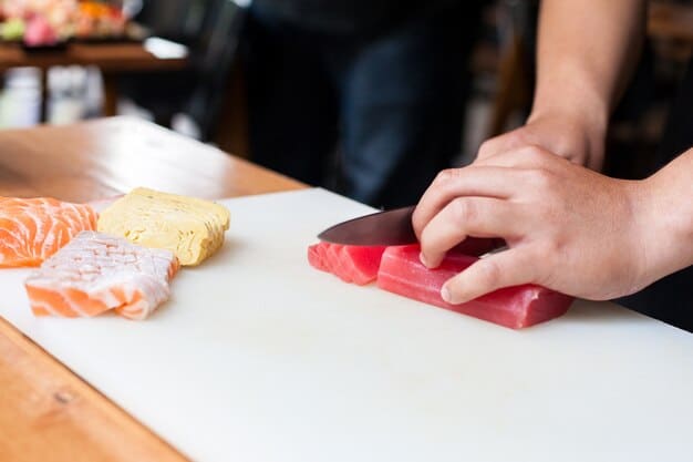 A close-up shot of a chef expertly slicing a block of sashimi-grade tuna, showcasing the rich color and texture of the fish.
