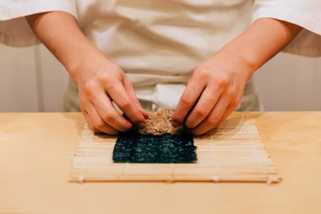 Top-down vibrant shot of a person's hands expertly shaping onigiri using a bamboo mold, with a bowl of perfectly cooked, glistening sushi rice nearby. The background includes various onigiri fillings in small bowls, such as salmon flakes, wakame seaweed, and umeboshi plums.