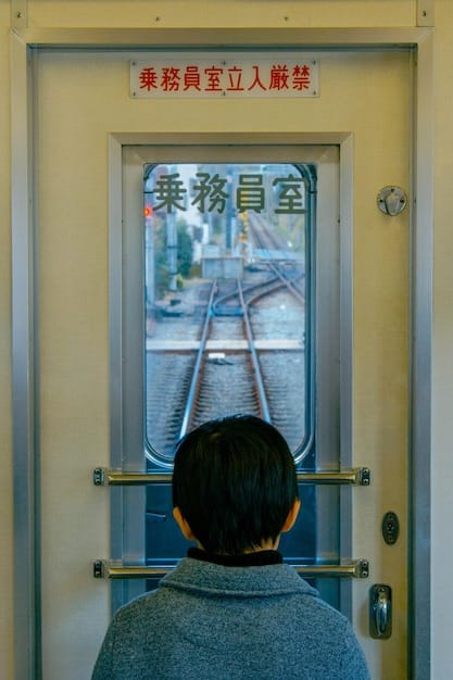 A close up of a sign inside a train in Japan showing a crossed out mobile phone icon indicating that phone calls are prohibited in priority seating areas. The sign is written in Japanese and English.