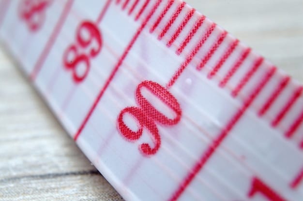 A close-up of a tape measure showing both inches and centimeters, draped over a piece of Japanese fabric, symbolizing the importance of accurate measurement conversion between the two systems.